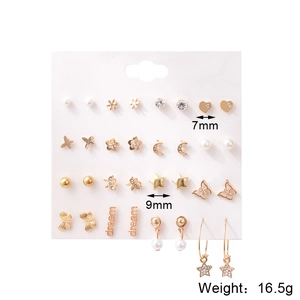 Detail view of 9 pairs gold stud earrings set featuring pearl heart and star shapes