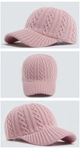 Detail view showing pink cable knit texture and sturdy brim of the winter baseball hat
