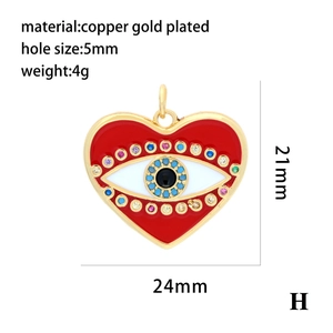 Detail of red enamel heart evil eye pendant showing copper gold plating and dimensions