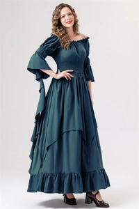 Detail of dark green Renaissance dress featuring ruffled hem and flare trumpet sleeves