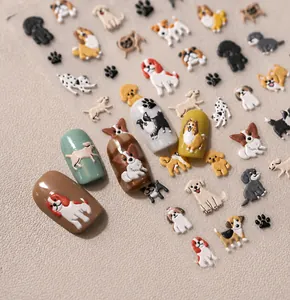 Close-up of 3D embossed cartoon dog nail stickers TS-3702 on various nail tips