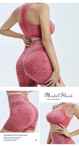 Detail of red marl seamless yoga shorts with high waist and breathable knit texture