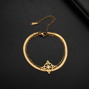 Macro detail of gold stainless steel snake chain and double-layered Celtic knot bracelet