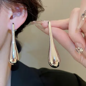 Polished silver teardrop earrings for women, minimalist drop design in metallic finish