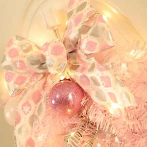 Pink Christmas teardrop wreath with bow, glitter ball, and Merry Christmas sign