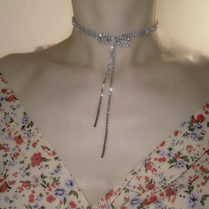 Elegant silver choker necklace with rhinestone bowknot and tassel pendant for women