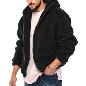 Close-up of black fleece jacket with metal zipper and tactical sleeve ornament detail