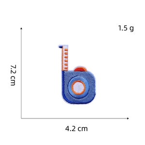 Detailed view of cartoon embroidered patch with dimensions 7.2x4.2cm on a white background