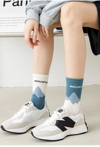 Detail of mountain knit socks in blue and white with ribbed cuffs for outdoor style