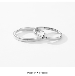Close-up of S925 sterling silver adjustable rings with sun and moon engraved patterns