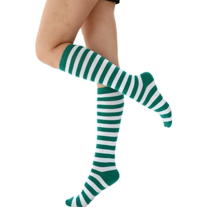 Detailed knit texture of green and white striped knee-high socks on a model