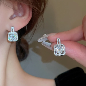 Sparkling square zircon stud earrings with silver needles showing detailed craftsmanship