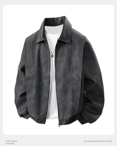 Detail of premium grey faux suede jacket featuring ribbed cuffs and metal zipper closure