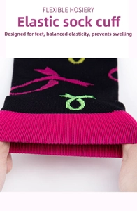 Close-up of flexible elastic cuff on black compression socks with pink contrast details