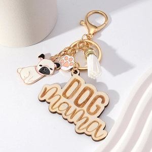 Dog Mama wood keychain with tassel, pug charm and paw print detail for pet lovers