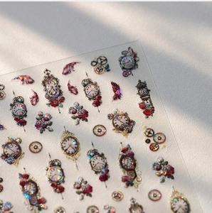 Detail of vintage pocket watch and rose stickers with laser finish and metallic texture