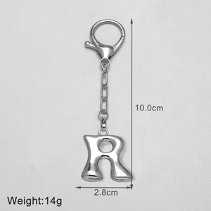 Polished silver metal letter R keychain accessory showing dimensions 10cm by 2.8cm