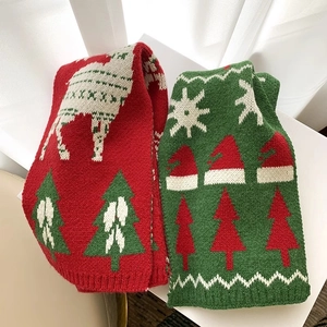 Children's knitted Christmas scarves with reindeer and tree patterns in red and green colors