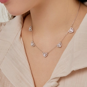 Elegant S925 sterling silver necklace with five heart pendants and shiny zircon crystals