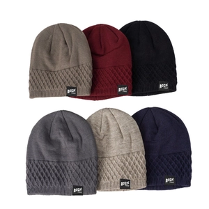 Detail showing various colors of knitted beanies with textured patterns and side labels