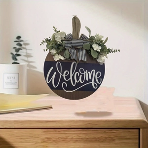 Close-up of welcome wooden door sign with white hydrangea, greenery and striped bow