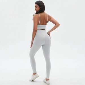 Detail view of seamless back design for light grey yoga bra and high waist leggings set