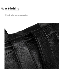 Close-up of durable litchi grain leather with precise and neat stitching on a black backpack