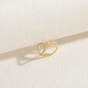 Macro view of a 14K gold plated open ring featuring mini pearls and zircon stones
