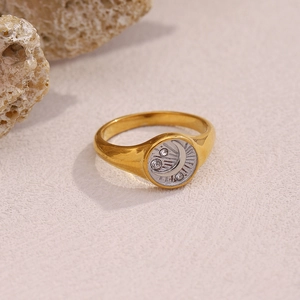 Detail of 18K gold plated moon and star signet ring with micro-inlaid zircon details