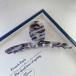 Detail of 13.5cm purple marble acetate hair claw clip with elegant French style texture