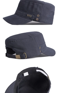 Detail view of navy blue cotton cadet hat with metal sports badge and adjustable buckle