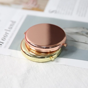 Portable round folding metal makeup mirrors in rose gold and gold finishes