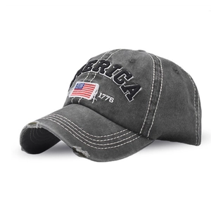 Close-up of distressed cotton baseball cap with AMERICA 1776 embroidery and US flag patch