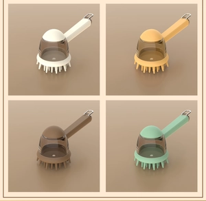 Detail of soft silicone pet bath brushes in four colors with liquid storage and metal hooks
