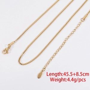 Detailed view of golden box chain necklace with lobster clasp and adjustable length extension