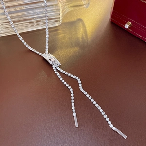 Close-up of elegant silver Y-shaped tassel necklace with sparkling zircon pavé setting