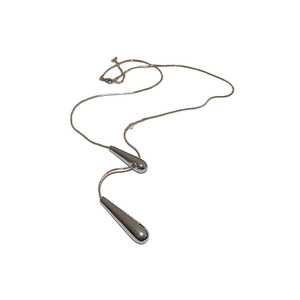 Minimalist silver water drop pendant necklace on white background with sleek metal shine