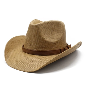 Classic straw western cowboy hat with brown leather band and curved brim for beach sun protection
