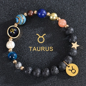 Macro shot of Taurus beaded bracelet with volcanic stone and celestial planet beads