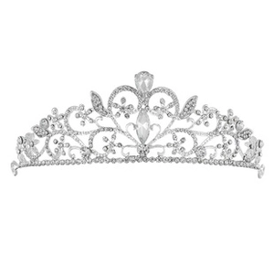 Macro detail of silver baroque princess crown with floral patterns and clear crystals