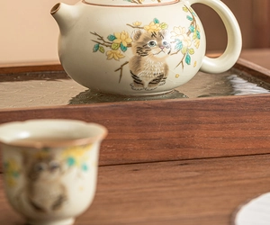 Ceramic Ru kiln teapot and cup set with cute tiger and floral pattern on wooden tray