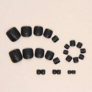 Glossy black press-on toe nails set with shiny finish for professional pedicure look
