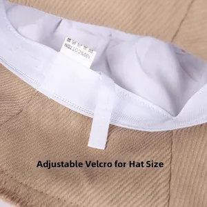 Detail of beige cotton bucket hat with adjustable Velcro strap and 100% cotton label