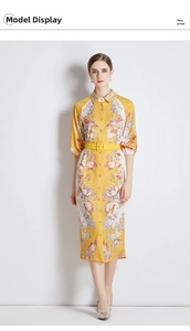 Detail of floral paisley shirt dress featuring 3/4 puff sleeves and a matching yellow belt