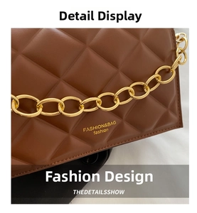Detail of brown quilted leather bag featuring gold chain and textured rhombus pattern