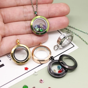 Detailed view of colorful glass locket pendants in rainbow, gold, and silver finishes