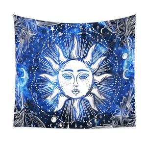 Detail of sun and moon astrology tapestry with celestial patterns in blue and white