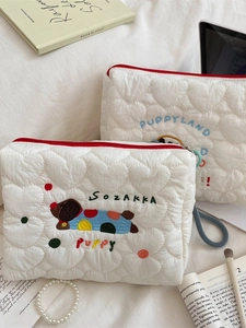 Quilted heart pattern makeup bag with cute dog embroidery and red zipper closure