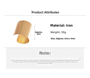 Detailed view of wide gold iron cuff bracelet featuring unique hammered metal texture