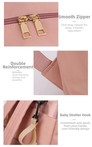 Pink diaper bag detail showing durable gold zippers and stroller hooks for convenience